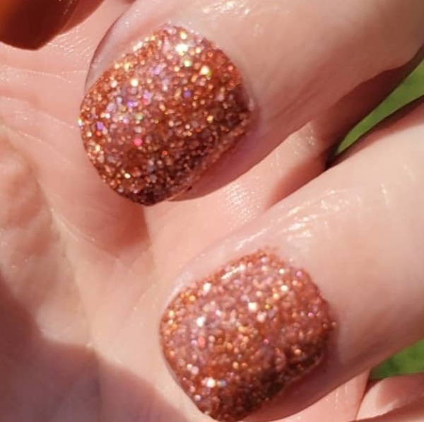 Nail polish swatch / manicure of shade Revel Amber