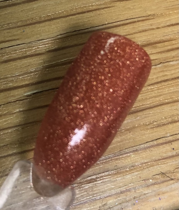 Nail polish swatch / manicure of shade Revel Ruby